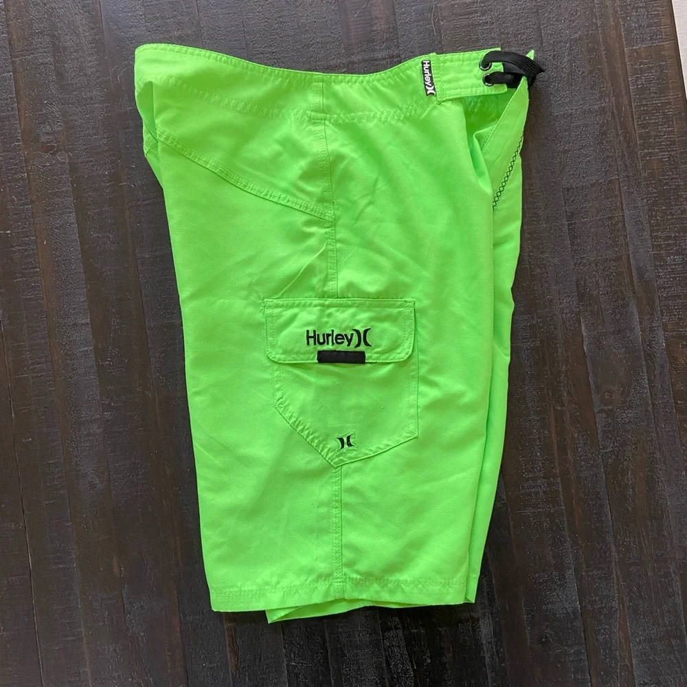 Bright green Hurley board shorts size 28”